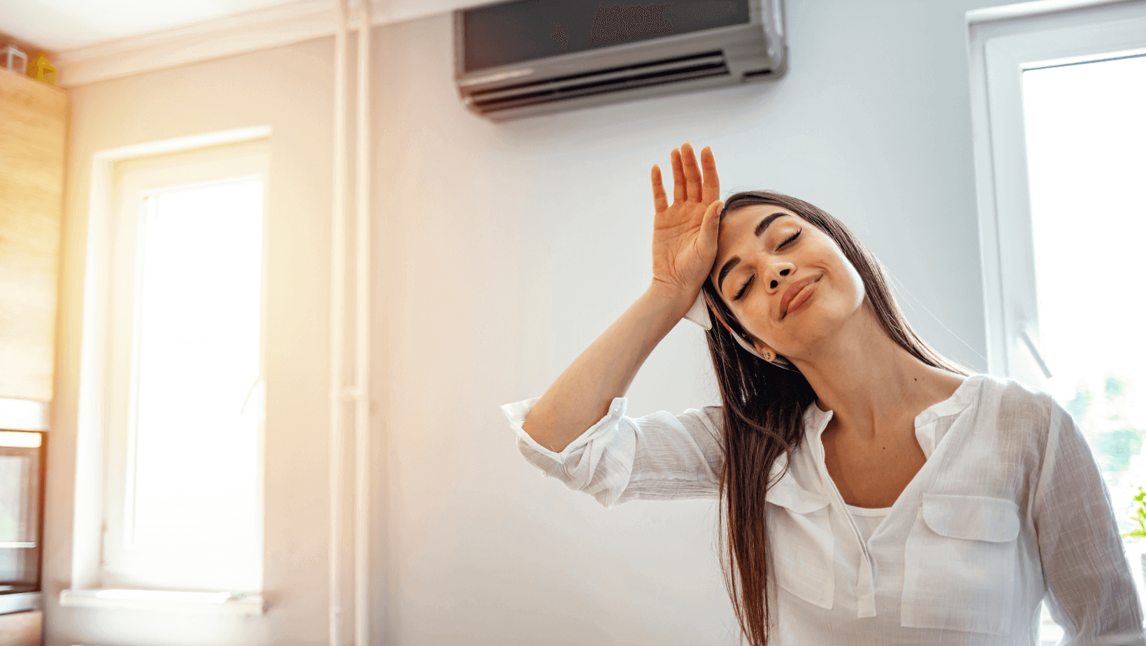 Woman Using AC on a Hot Summer Day
