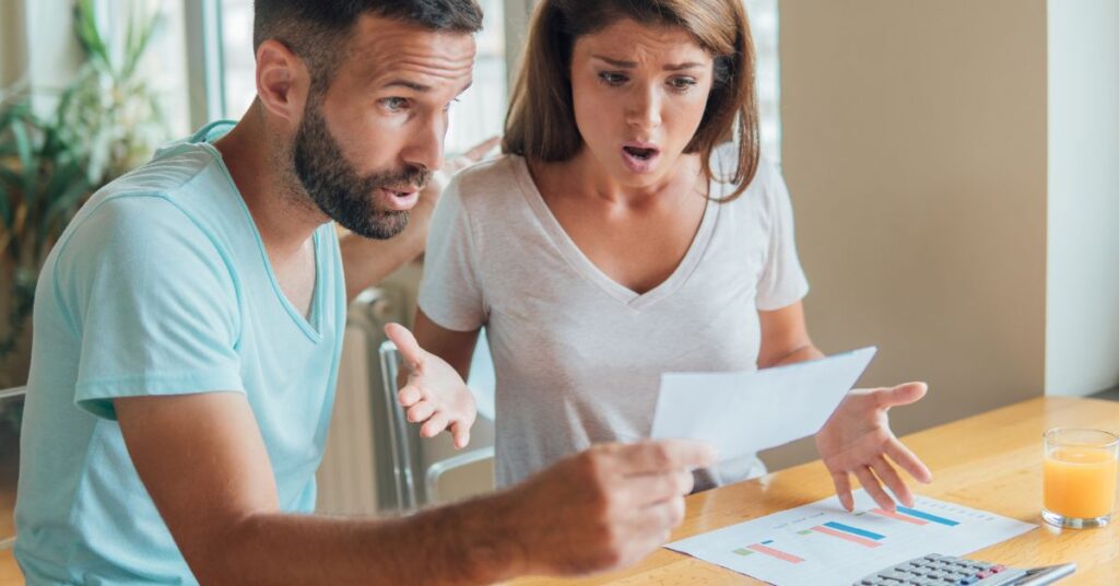 Homeowner reviewing rising utility bills